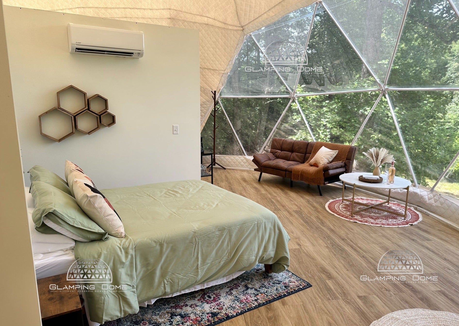 queen size bed and panoramic window in the 29.5ft diameter glamping dome